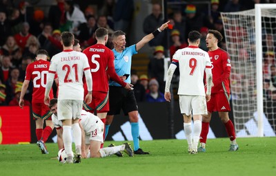 260324 - Wales v Poland, Euro 2024 qualifying Play-off Final - Chris Mepham of Wales is shown a red card