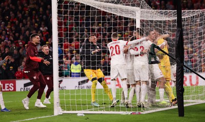 260324 - Wales v Poland, Euro 2024 qualifying Play-off Final - Poland celebrate after Daniel James of Wales has his penalty saved, taking them through to the the Euro Finals