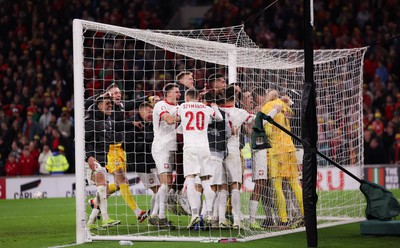 260324 - Wales v Poland, Euro 2024 qualifying Play-off Final - Poland celebrate after Daniel James of Wales has his penalty saved, taking them through to the the Euro Finals