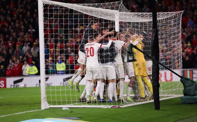 260324 - Wales v Poland, Euro 2024 qualifying Play-off Final - Poland celebrate after Daniel James of Wales has his penalty saved, taking them through to the the Euro Finals