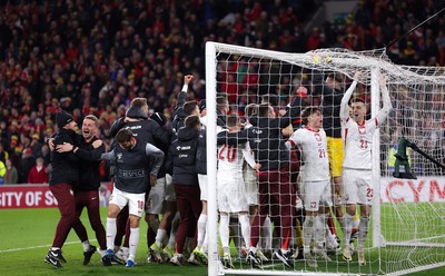 260324 - Wales v Poland, Euro 2024 qualifying Play-off Final - Poland celebrate after Daniel James of Wales has his penalty saved, taking them through to the the Euro Finals