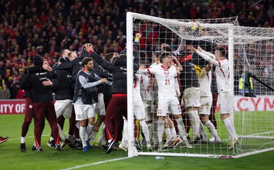 260324 - Wales v Poland, Euro 2024 qualifying Play-off Final - Poland celebrate after Daniel James of Wales has his penalty saved, taking them through to the the Euro Finals