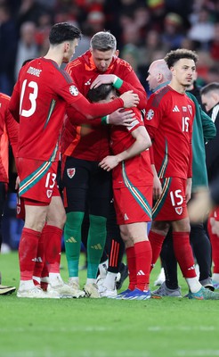 260324 - Wales v Poland, Euro 2024 qualifying Play-off Final - Daniel James of Wales is consoled after Wales lose the penalty shootout