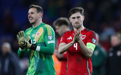 260324 - Wales v Poland, Euro 2024 qualifying Play-off Final - Ben Davies of Wales and Wales goalkeeper Danny Ward at the end of the match after Wales lose the penalty shootout