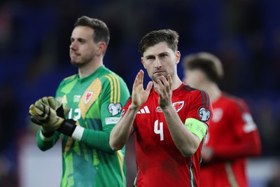 260324 - Wales v Poland, Euro 2024 qualifying Play-off Final - Ben Davies of Wales and Wales goalkeeper Danny Ward at the end of the match after Wales lose the penalty shootout