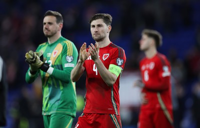 260324 - Wales v Poland, Euro 2024 qualifying Play-off Final - Ben Davies of Wales and Wales goalkeeper Danny Ward at the end of the match after Wales lose the penalty shootout