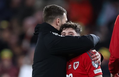 260324 - Wales v Poland, Euro 2024 qualifying Play-off Final - Daniel James of Wales is consoled after Wales lose the penalty shootout