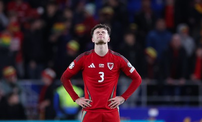 260324 - Wales v Poland, Euro 2024 qualifying Play-off Final - Neco Williams of Wales after Wales lose the penalty shootout