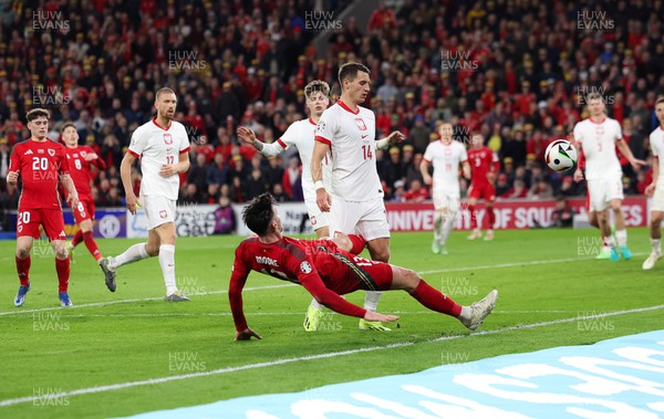 260324 - Wales v Poland, Euro 2024 qualifying Play-off Final - Kieffer Moore of Wales is denied a penalty as he goes down