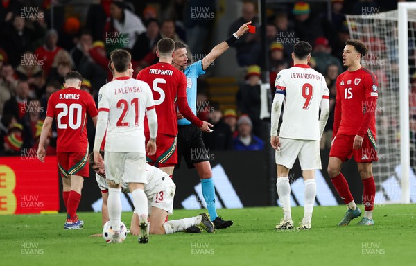 260324 - Wales v Poland, Euro 2024 qualifying Play-off Final - Chris Mepham of Wales is shown a red card