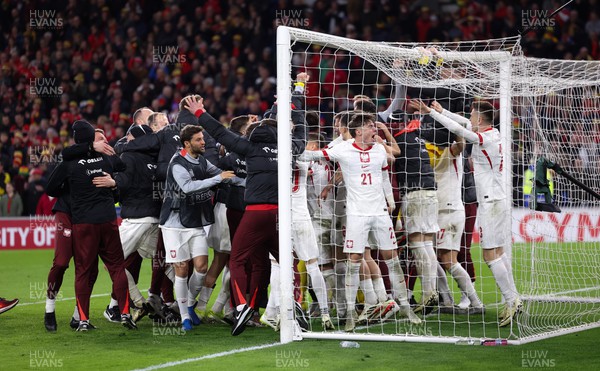 260324 - Wales v Poland, Euro 2024 qualifying Play-off Final - Poland celebrate after Daniel James of Wales has his penalty saved, taking them through to the the Euro Finals