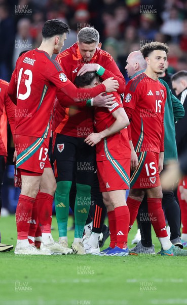 260324 - Wales v Poland, Euro 2024 qualifying Play-off Final - Daniel James of Wales is consoled after Wales lose the penalty shootout