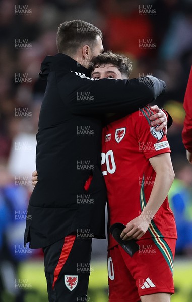 260324 - Wales v Poland, Euro 2024 qualifying Play-off Final - Daniel James of Wales is consoled by Aaron Ramsey after Wales lose the penalty shootout