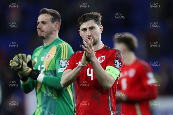 260324 - Wales v Poland, Euro 2024 qualifying Play-off Final - Ben Davies of Wales and Wales goalkeeper Danny Ward at the end of the match after Wales lose the penalty shootout