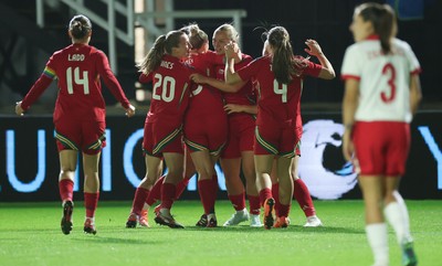 281025 - Wales v Poland, Women’s International Challenge Match - Wales celebrate with Elise Hughes of Wales after she scores the opening goal