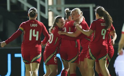 281025 - Wales v Poland, Women’s International Challenge Match - Wales celebrate with Elise Hughes of Wales after she scores the opening goal