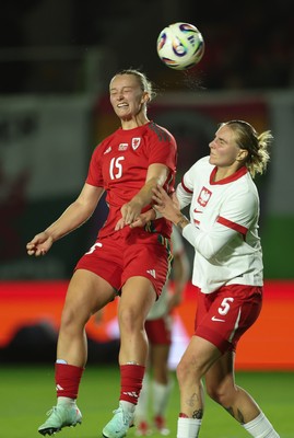 281025 - Wales v Poland, Women’s International Challenge Match - Elise Hughes of Wales wins the ball from Oliwia Wos of Poland