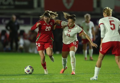 281025 - Wales v Poland, Women’s International Challenge Match - Carrie Jones of Wales holds off Emilia Szymczak of Poland