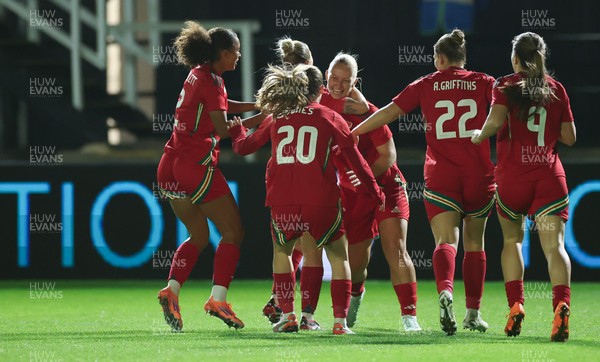 281025 - Wales v Poland, Women’s International Challenge Match - Wales celebrate with Elise Hughes of Wales after she scores the opening goal