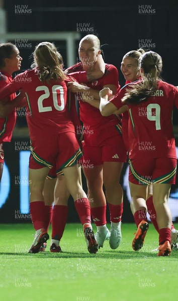 281025 - Wales v Poland, Women’s International Challenge Match - Wales celebrate with Elise Hughes of Wales after she scores the opening goal