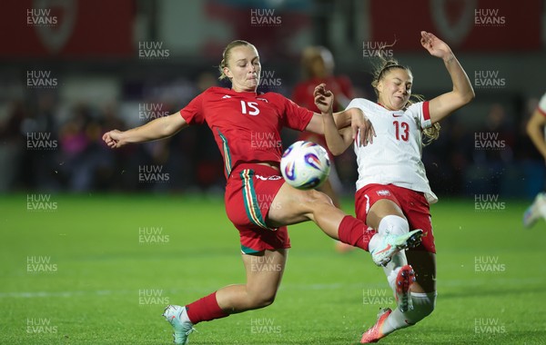 281025 - Wales v Poland, Women’s International Challenge Match - Elise Hughes of Wales and Emilia Szymczak of Poland compete for the ball