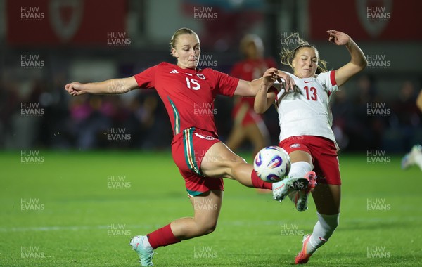 281025 - Wales v Poland, Women’s International Challenge Match - Elise Hughes of Wales and Emilia Szymczak of Poland compete for the ball