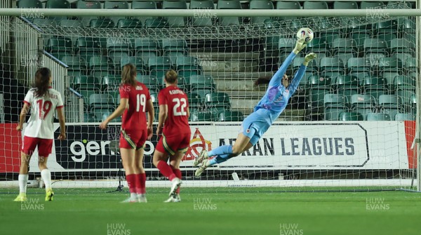 281025 - Wales v Poland, Women’s International Challenge Match - Wales goalkeeper Olivia Clark is beaten by a shot from Milkena Kokosz of Poland