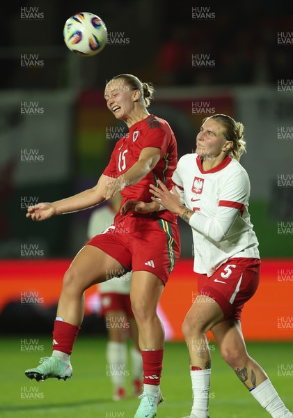 281025 - Wales v Poland, Women’s International Challenge Match - Elise Hughes of Wales wins the ball from Oliwia Wos of Poland