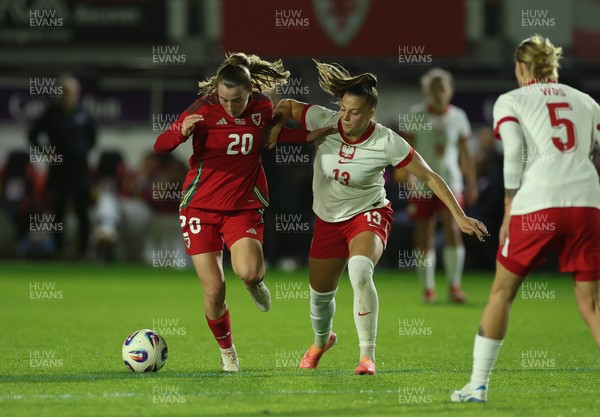 281025 - Wales v Poland, Women’s International Challenge Match - Carrie Jones of Wales holds off Emilia Szymczak of Poland