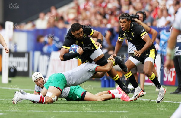 160923 - Wales v Portugal - Rugby World Cup France 2023 - Pool C - Taulupe Faletau of Wales is tackled by Joao Granate of Portugal 