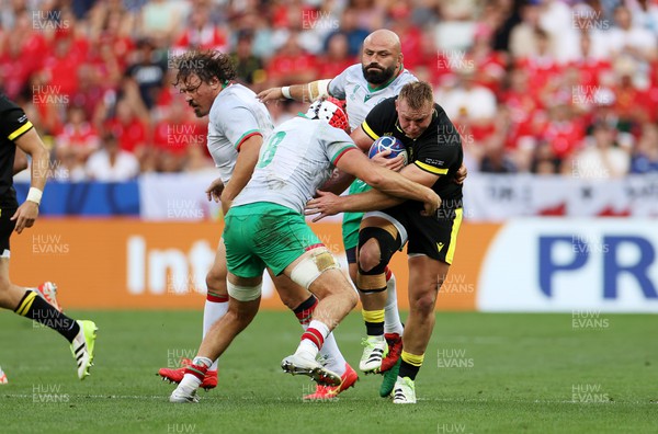 160923 - Wales v Portugal - Rugby World Cup France 2023 - Pool C - Dewi Lake of Wales is tackled by Rafael Simoes of Portugal 