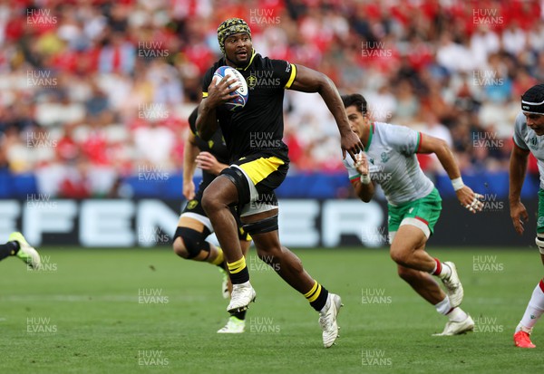 160923 - Wales v Portugal - Rugby World Cup France 2023 - Pool C - Christ Tshiunza of Wales finds a gap