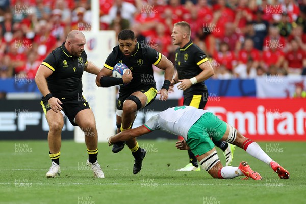 160923 - Wales v Portugal - Rugby World Cup France 2023 - Pool C - Taulupe Faletau of Wales is tackled by Jose Madeira of Portugal 
