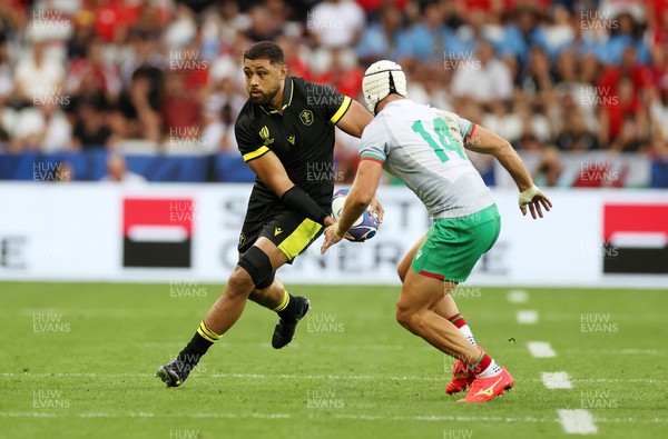160923 - Wales v Portugal - Rugby World Cup France 2023 - Pool C - Taulupe Faletau of Wales is challenged by Vincent Pinto of Portugal 