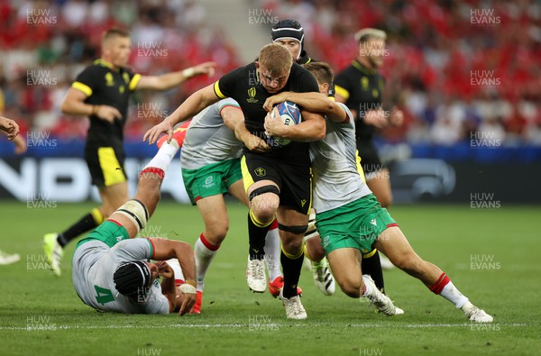 160923 - Wales v Portugal - Rugby World Cup France 2023 - Pool C - Jac Morgan of Wales is challenged by Jose Madeira of Portugal 