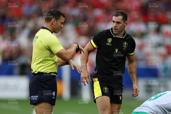 160923 - Wales v Portugal - Rugby World Cup France 2023 - Pool C - Tomos Williams of Wales looks at Referee Karl Dickson 