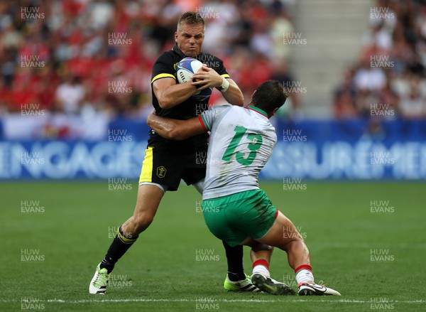 160923 - Wales v Portugal - Rugby World Cup France 2023 - Pool C - Gareth Anscombe of Wales is tackled by Jose Lima of Portugal 