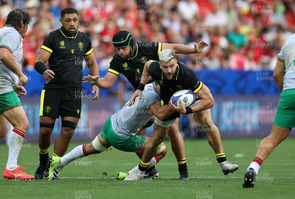 160923 - Wales v Portugal - Rugby World Cup France 2023 - Pool C - Johnny Williams of Wales is tackled by Nicolas Martins of Portugal 