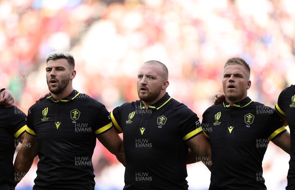 160923 - Wales v Portugal - Rugby World Cup France 2023 - Pool C - Johnny Williams, Dillon Lewis and Gareth Anscombe of Wales sing the anthem