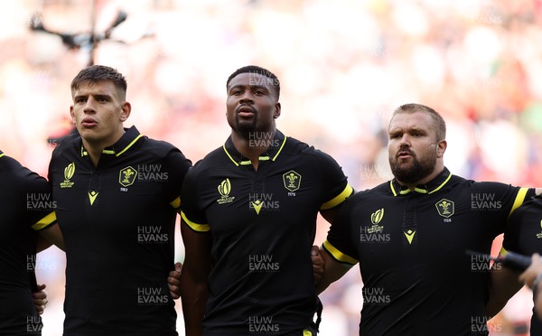 160923 - Wales v Portugal - Rugby World Cup France 2023 - Pool C - Dafydd Jenkins, Christ Tshiunza and Tomas Francis of Wales sing the anthem
