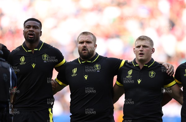 160923 - Wales v Portugal - Rugby World Cup France 2023 - Pool C - Christ Tshiunza, Tomas Francis and Jac Morgan sing the anthem