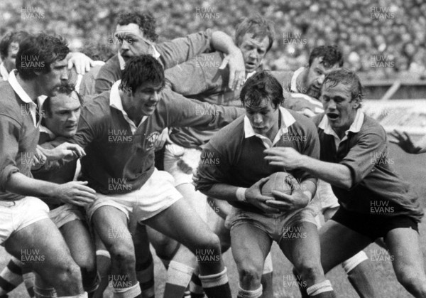 250481 - Wales v President's XV -  Terry Holmes in possession on the Welsh line as Peter Wheeler (rt) challenges 