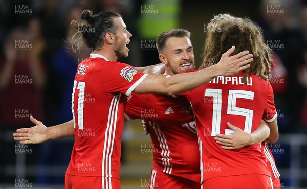 060918 - Wales v Republic of Ireland, UEFA Nations League - Aaron Ramsey of Wales celebrates with Gareth Bale of Wales  and Ethan Ampadu of Wales after he scores Wales' third goal