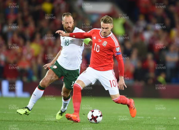091017 - Wales v Republic of Ireland - FIFA World Cup Qualifier 2018 - Aaron Ramsey of Wales is tackled by David Meyler of Republic of Ireland