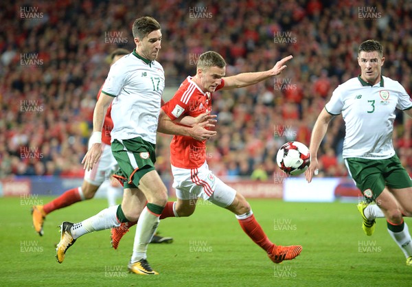 091017 - Wales v Republic of Ireland - FIFA World Cup Qualifier 2018 - Andy King of Wales is tackled by Stephen Ward of Republic of Ireland