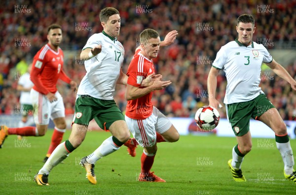 091017 - Wales v Republic of Ireland - FIFA World Cup Qualifier 2018 - Andy King of Wales is tackled by Stephen Ward of Republic of Ireland