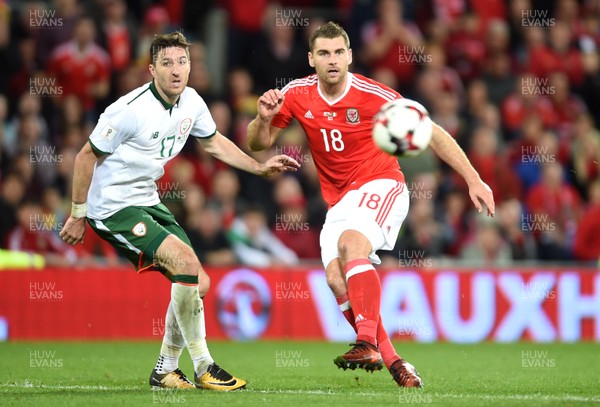 091017 - Wales v Republic of Ireland - FIFA World Cup Qualifier 2018 - Sam Vokes of Wales is tackled by Stephen Ward of Republic of Ireland