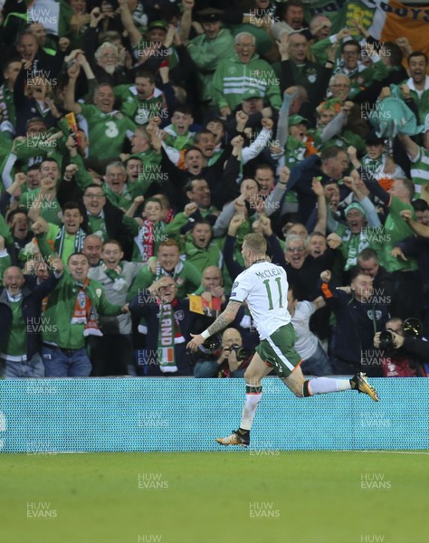 091017 - Wales v Republic of Ireland, FIFA World Cup 2018 Qualifier - James McClean of Republic of Ireland races away to celebrate in front of the travelling supporters after scoring goal