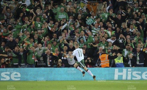 091017 - Wales v Republic of Ireland, FIFA World Cup 2018 Qualifier - James McClean of Republic of Ireland races away to celebrate in front of the travelling supporters after scoring goal