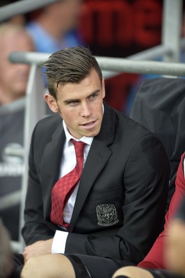 140813 - Wales v Republic of Ireland, International Friendly -   Gareth Bale of Wales takes his place on the bench before the match